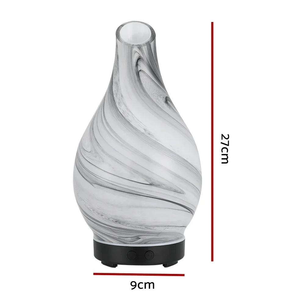 Glass swirl essential oil diffuser with 27cm height and 9cm width, tabletop design.