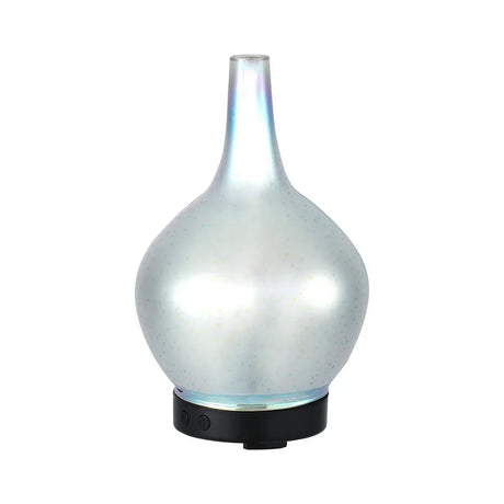 Modern glass essential oil diffuser with iridescent finish and black base on white background