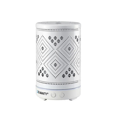 White electric aroma diffuser with geometric cutout design, power buttons on base