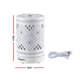 White cylindrical electric aroma diffuser with geometric cutout pattern, size 16cm x 9cm, and power cable.