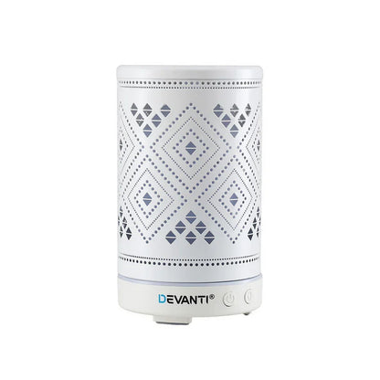 White electric aroma diffuser with geometric cut-out pattern and control buttons