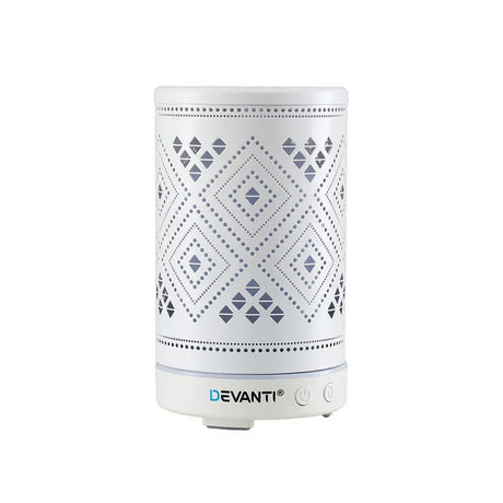 White electric aroma diffuser with geometric cut-out pattern and control buttons