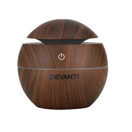 Wood grain round essential oil diffuser with power button and open lid, DEVANTI logo visible.