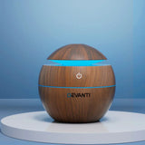 Wood grain sphere aroma diffuser with blue LED light on display stand