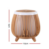 Wooden slatted essential oil diffuser with tripod legs, 13cm tall, 11.5cm wide.