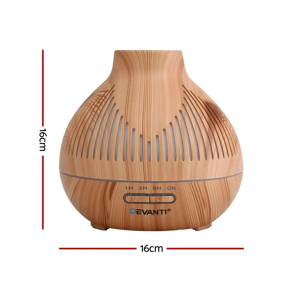 Wood grain essential oil diffuser with timer, 16cm tall and 16cm wide, on white background.