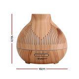 Wood grain essential oil diffuser with timer, 16cm tall and 16cm wide, on white background.
