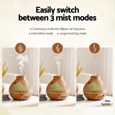 A wood grain essential oil diffuser displaying three adjustable mist modes on a white table.