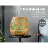 Woodgrain essential oil diffuser with green LED light and mist, suitable for 25-35m² rooms.