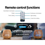 Remote control essential oil diffuser with 400ml capacity, timer, light, and mist settings.