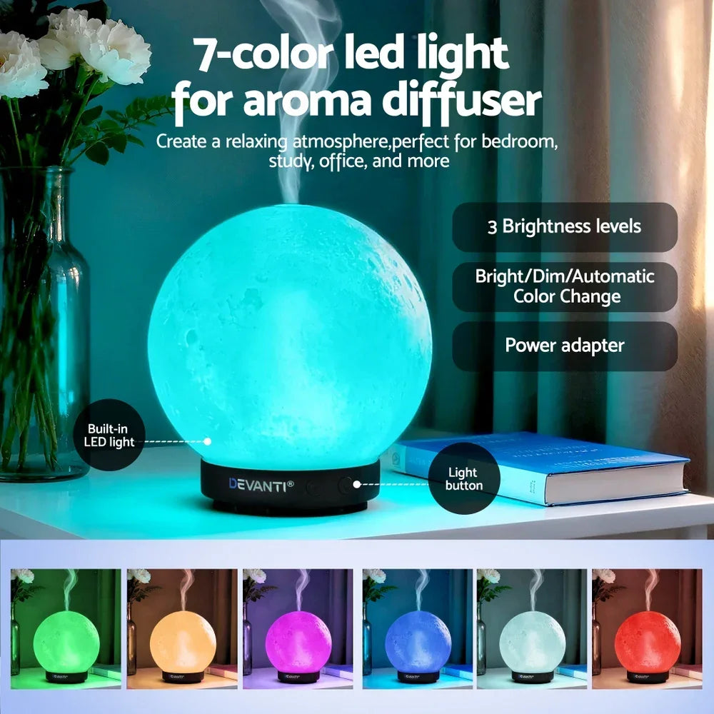 7-color LED moon lamp aroma diffuser with steam, adjustable brightness, and color options on a desk.