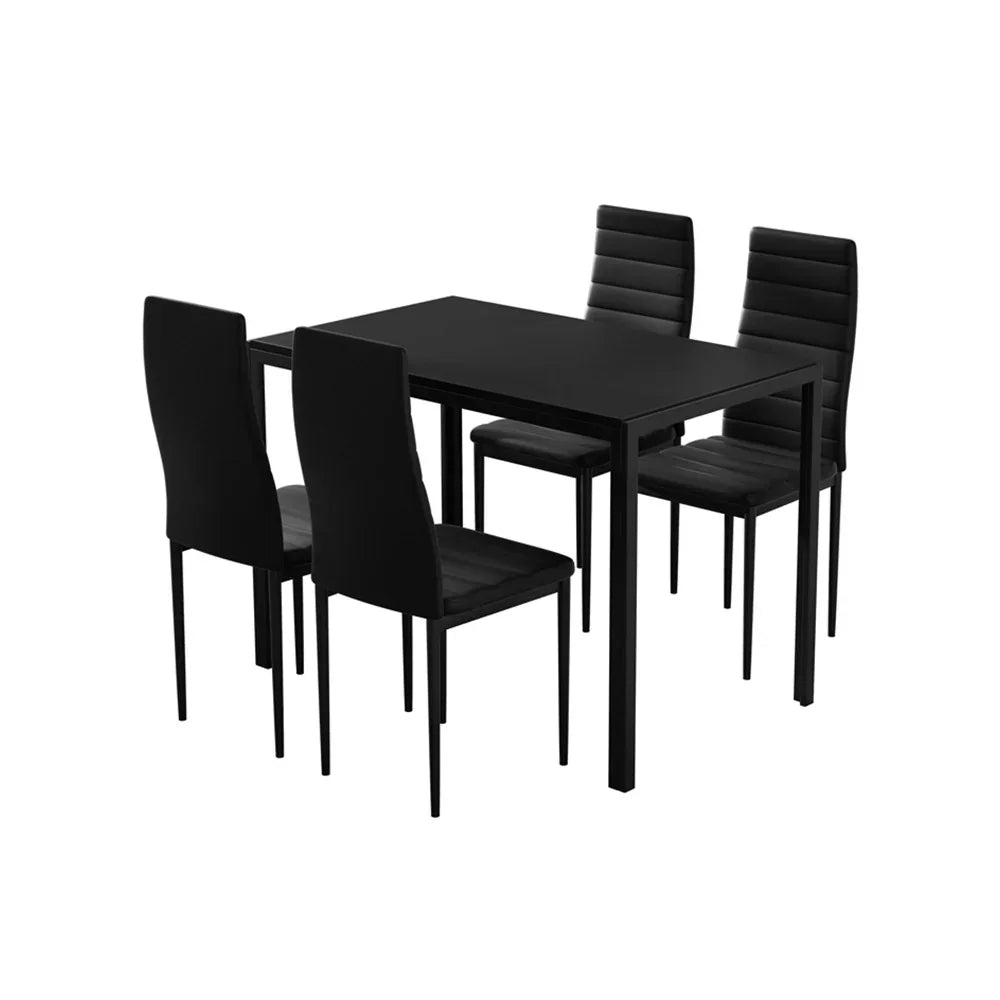Modern black dining table set with four matching chairs, minimalist design, isolated on white