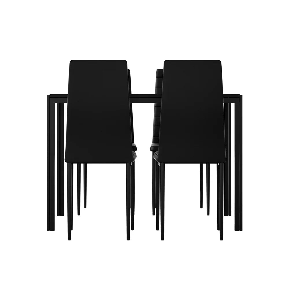 Modern black dining table with four matching black chairs, minimalistic design