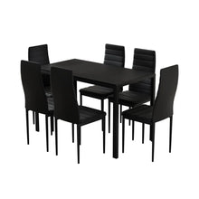 Modern black dining table set with six matching chairs, minimalist design, indoor furniture.