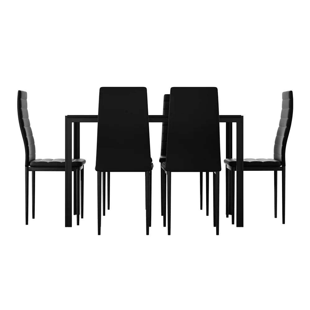 Modern black dining table set with four padded chairs on a white background