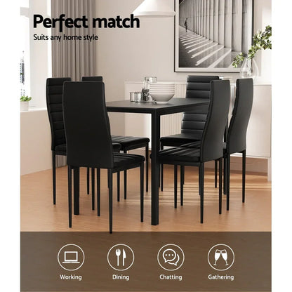 Modern black dining table set with six chairs in a bright minimalist dining room