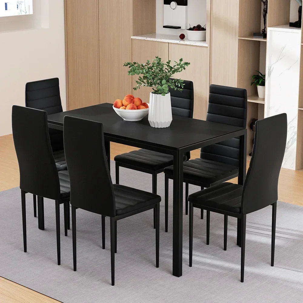 Modern black dining table set with six chairs in a contemporary kitchen setting
