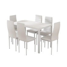 Modern white dining table set with six padded chairs on a white background