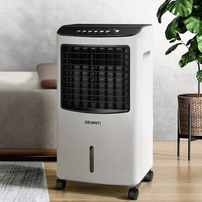 Portable evaporative air cooler with control panel and wheels in a modern room setting