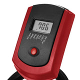 Close-up of a digital exercise bike display with red frame, LCD screen, and control button