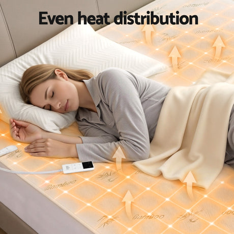 Woman sleeping on bamboo electric heated mattress topper with even heat distribution