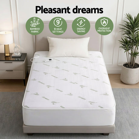 Bamboo fabric electric mattress protector with controller, featuring 9 heat settings, on bed