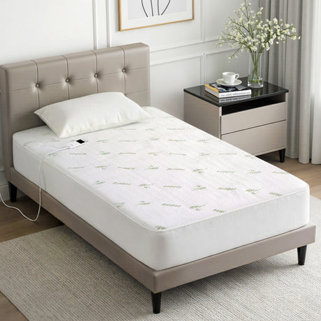 Single bed with bamboo-patterned electric heated mattress protector in modern bedroom
