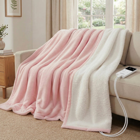 Pink and white electric heated throw blanket on a beige sofa in a cozy living room