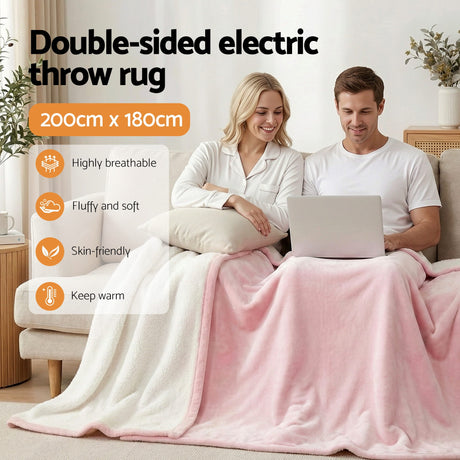 Double-sided electric throw rug 200x180cm in pink and white, soft and warm, on sofa with couple