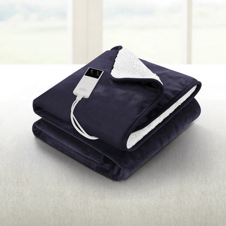 Dark electric heated throw blanket with digital controller on a light sofa