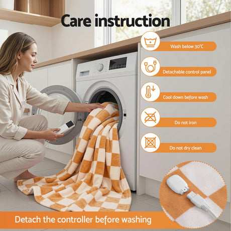 Woman removing detachable controller from orange checkered heated blanket before machine washing, laundry care instructions visible.