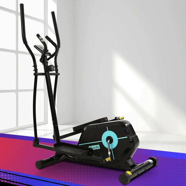 Black elliptical cross trainer exercise machine in a modern indoor gym setting
