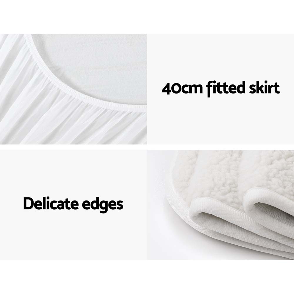 White fitted mattress protector with 40cm skirt and soft, delicate edges