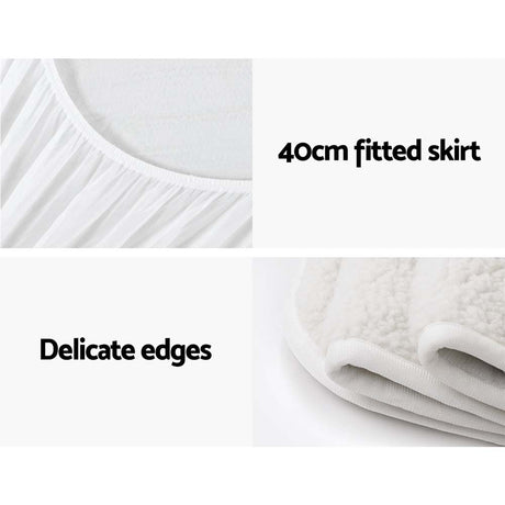 White fitted mattress protector with 40cm skirt and soft, delicate edges