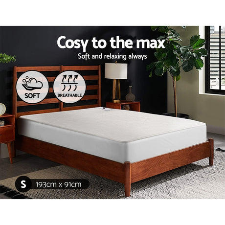 Single size memory foam mattress on wooden bed frame, soft and breathable, in modern bedroom