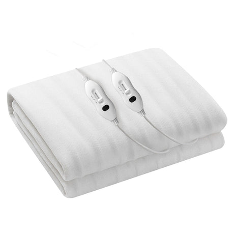 White electric blanket with dual controllers, folded on a clean surface