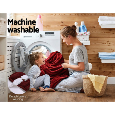 Mother and child with red machine washable throw rug in laundry room, showing easy care.