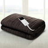 Dark grey electric heated blanket with digital controller on a light surface