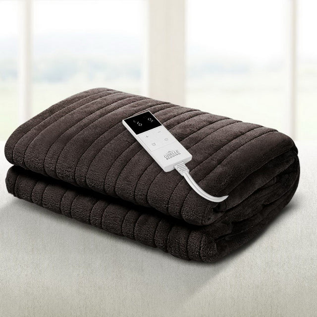 Dark grey electric heated blanket with digital controller on a light surface