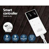 Electric blanket smart controller with LED display, heat and timer settings on dark fabric background