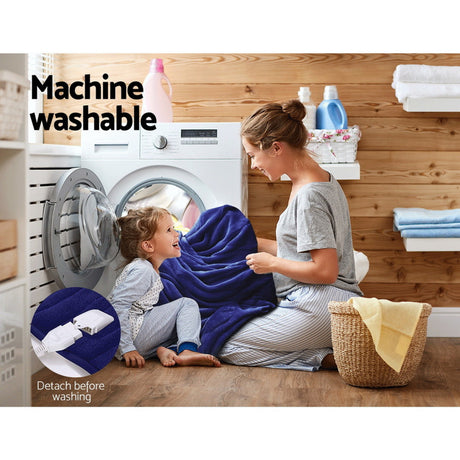 Mother and child with blue electric throw blanket near washing machine, laundry room, machine washable, detach before washing.