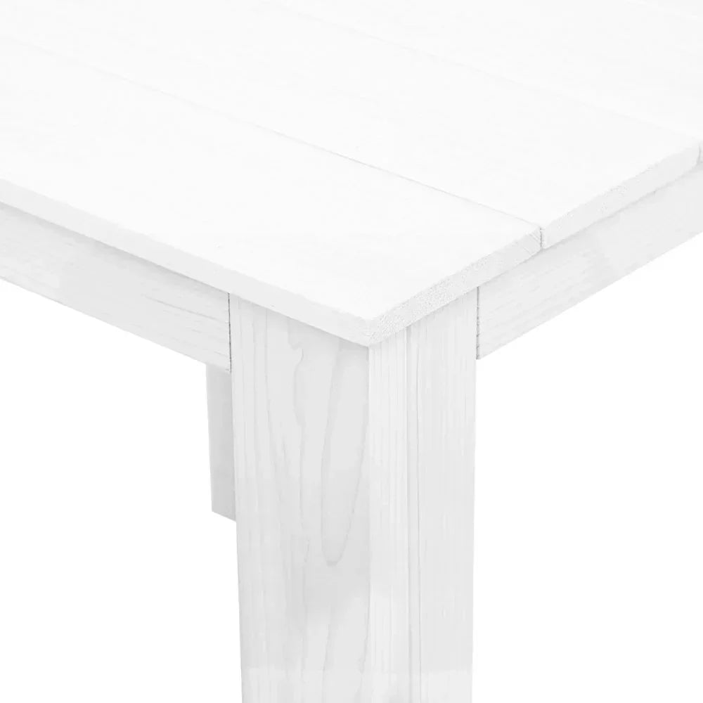 Close-up of white wooden outdoor table corner with slatted top and sturdy leg