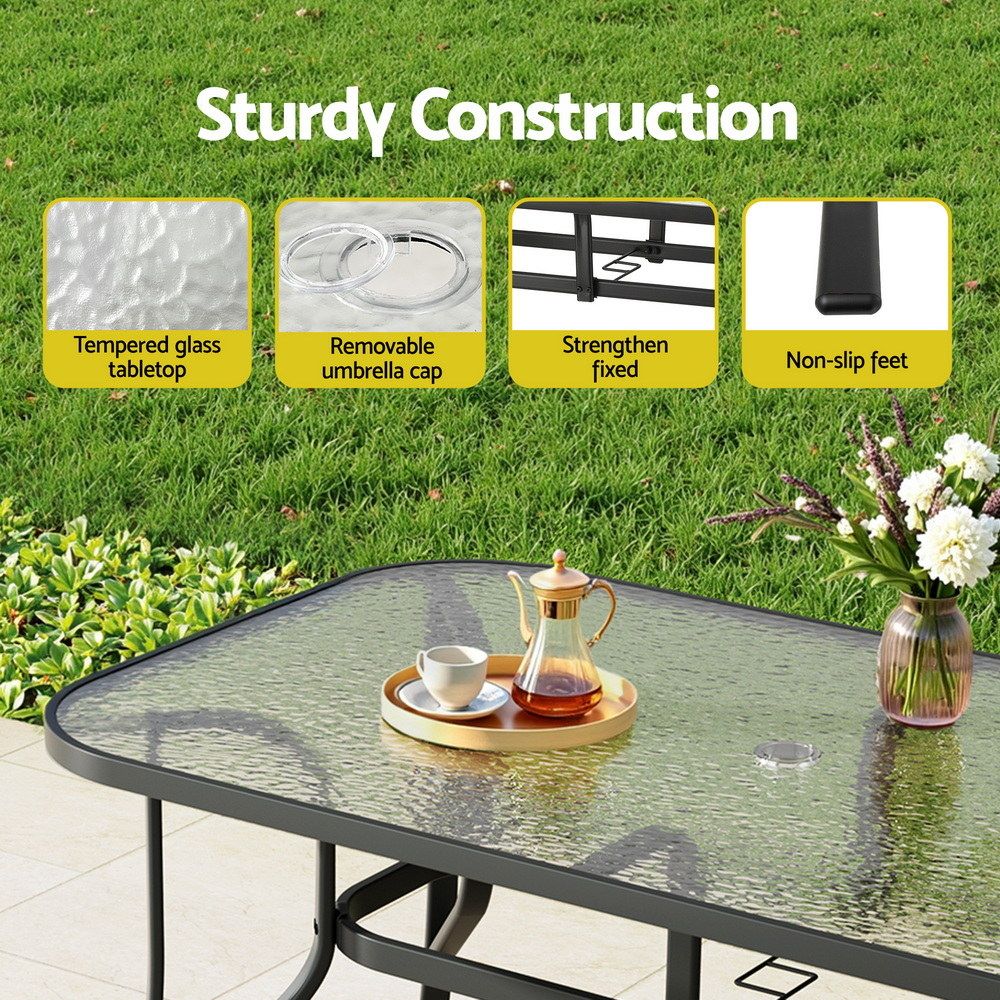 Five piece black outdoor dining setting sized for four people on a patio, deck or lawn