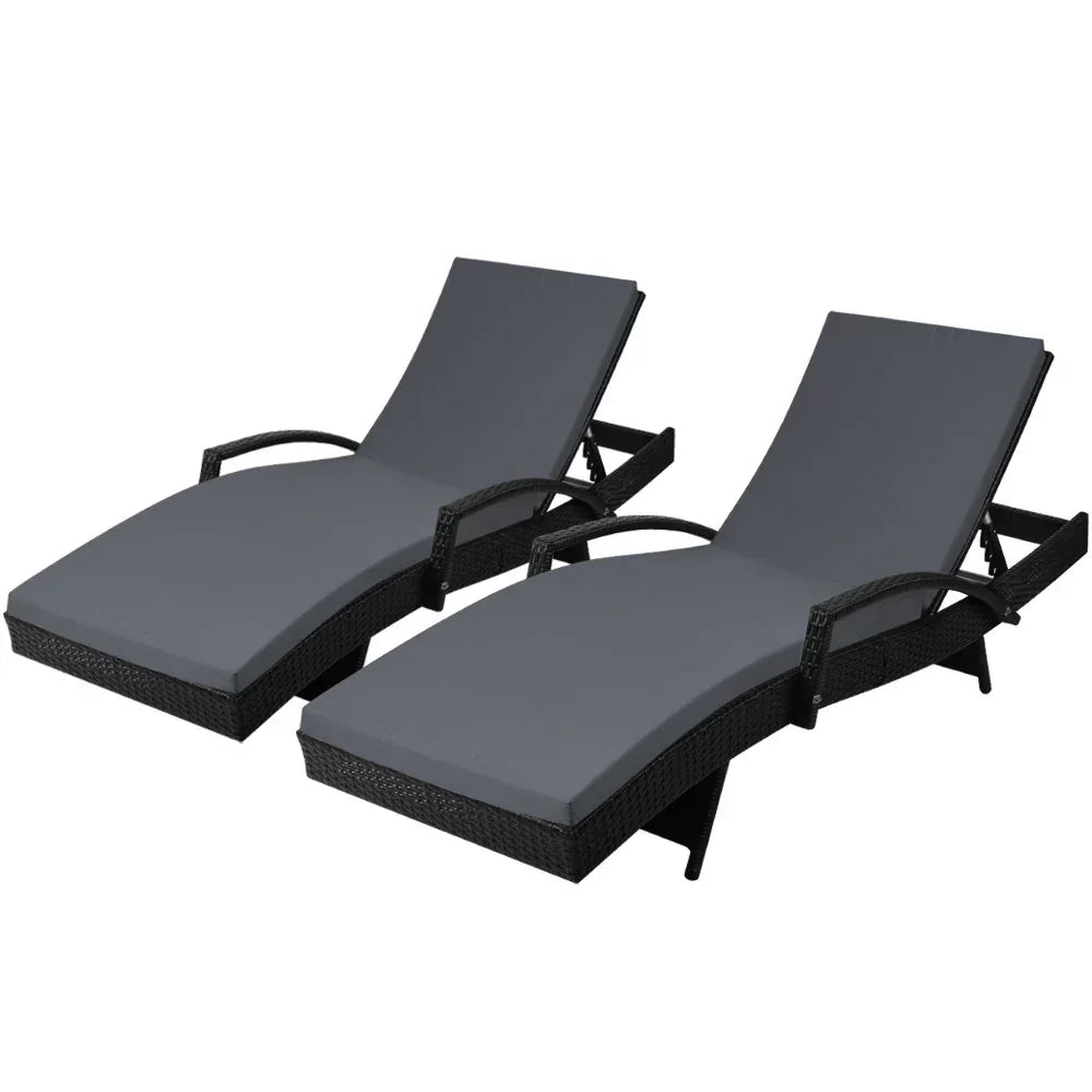 Pair of outdoor black wicker lounge chairs with grey cushions and adjustable backs