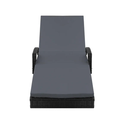 Outdoor lounge chair with dark rattan frame and grey cushion, viewed from the front