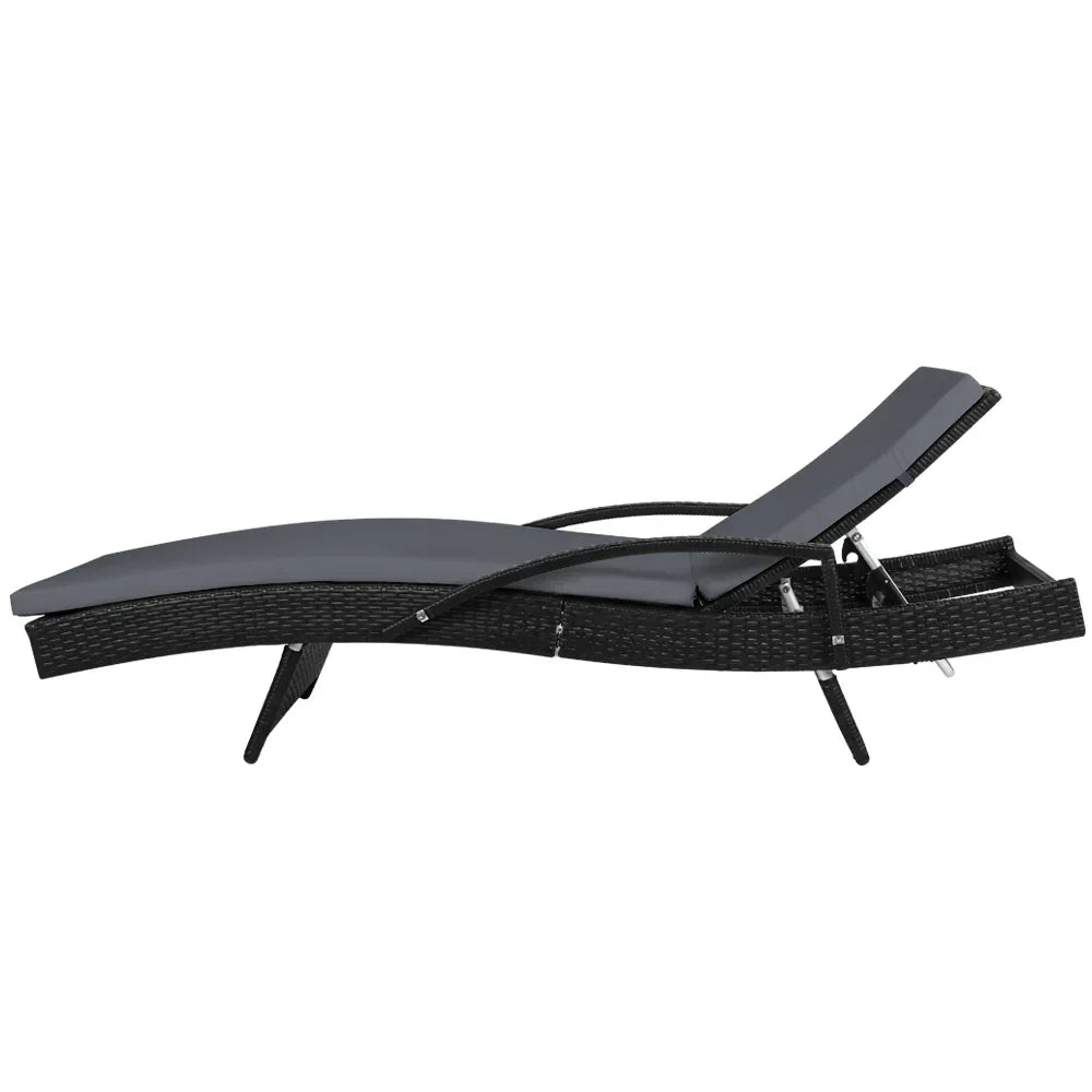 Black rattan outdoor lounge chair with adjustable backrest and dark grey cushion