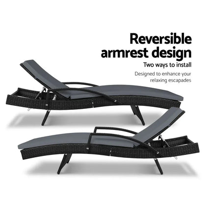 Black wicker outdoor lounge chairs with reversible armrests and adjustable backrests.
