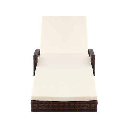 Outdoor wicker lounge chair with cream cushion and armrests, front view