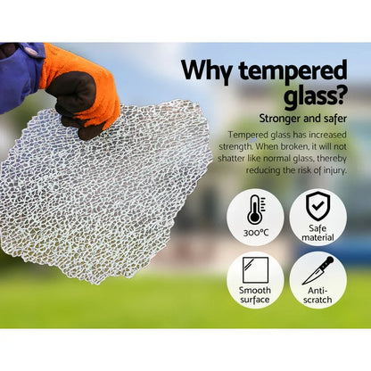 Gloved hand holding shattered tempered glass with safety benefits and icons displayed.
