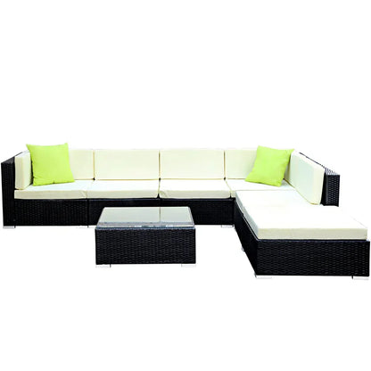 7-piece outdoor wicker sofa set with cream cushions, lime pillows, and glass coffee table